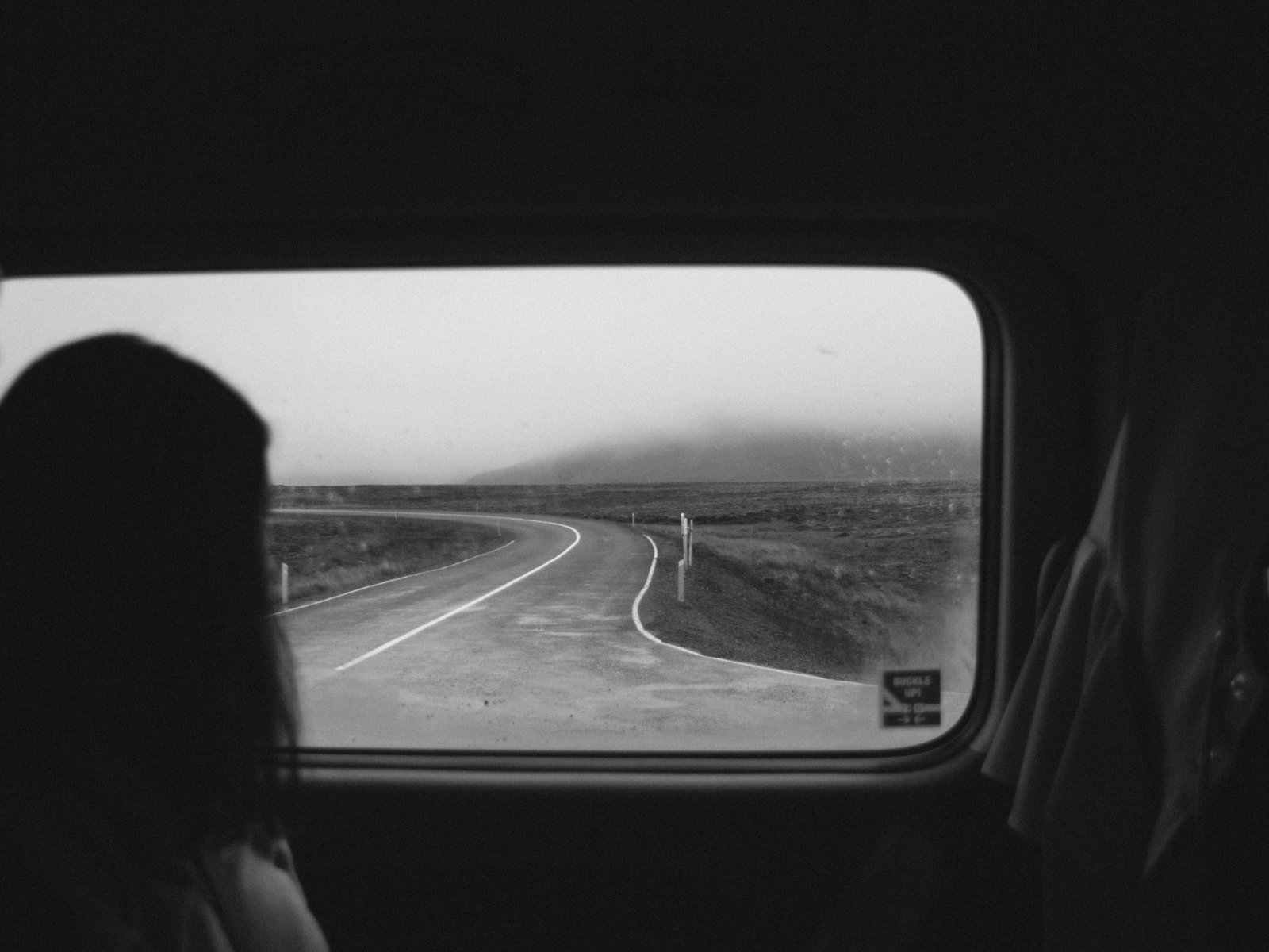 A winding road seen through a vehicle window in black and white, a picture of the clear path Switch argues organizational change needs before people will follow it
